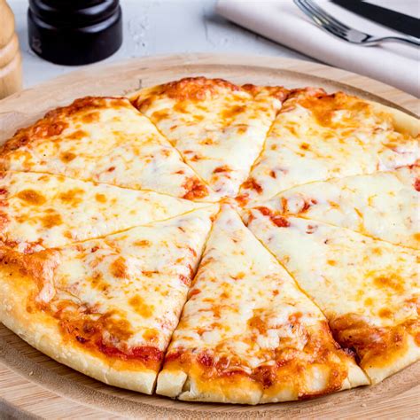 Pizza with cheese. Preheat the oven to 450°F. In a large bowl, mix 1 cup of mozzarella cheese, the Cheddar cheese, egg, garlic powder, salt, and pepper. On a parchment-lined 16-inch pizza pan, spread the cheese dough evenly around the pan. The crust should be thin, but without any holes. Place the pan in the oven. Bake the crust for 15 to 20 minutes, or until ... 