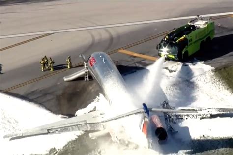 Plane catches fire after crash landing at Miami airport