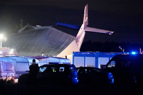 Plane hits hangar where people were sheltering in storm in Poland. Pilot and 4 others die and 8 hurt