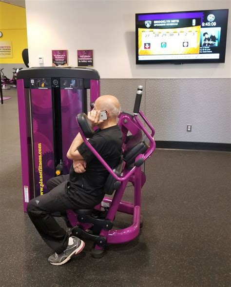 Planet fitness ab machines. A. Stand to the right of the high pulley of a cable machine and grab the handle with straight arms over left shoulder. B. Keeping arms straight, pull the handle down and across body to right hip, twisting at the core and hips. C. Return to starting position and repeat. Finish the set, then repeat on the other side. 