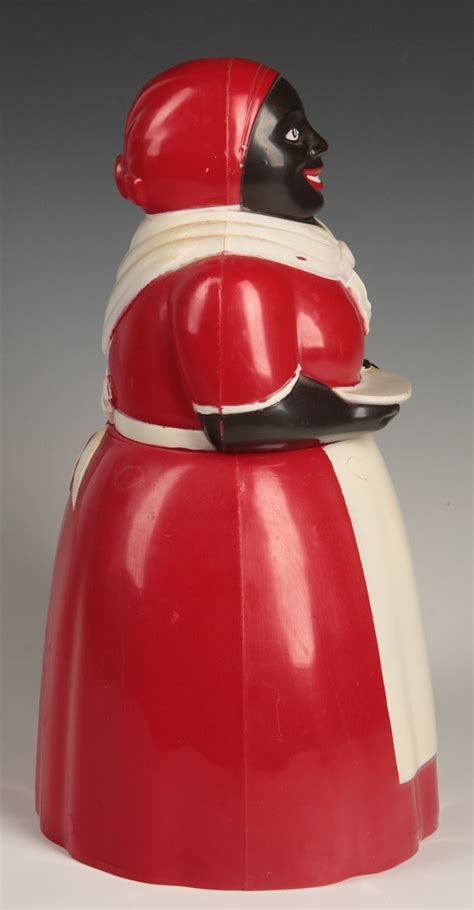 45: A VINTAGE F&F AUNT JEMIMA RED PLASTIC COOKIE JAR Measures 11.5 x 7 x 6 inches, markings on the base. We ship in-house for all items with the exception of very large and or very fragile pieces and some international shipments. Very good condition. $100 - …