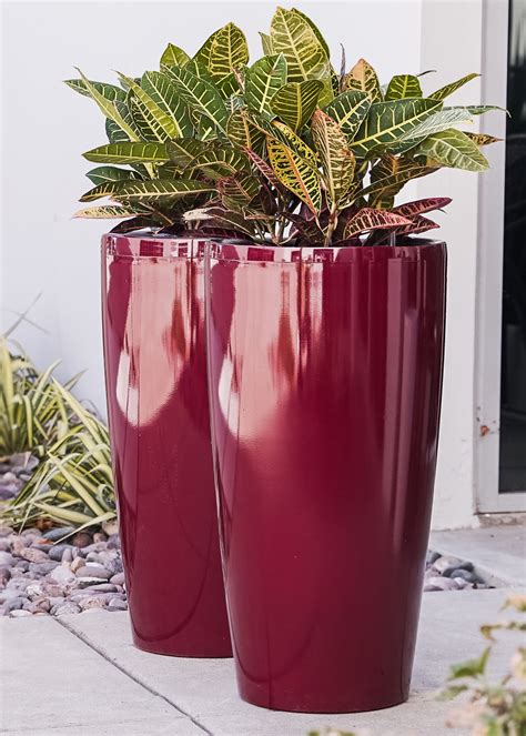  Options from $34.14 – $40.50. DCN Plastic Tall Azura Urn Planter, Black, 20". 5. Free shipping, arrives in 3+ days. $ 4319. Camden Outdoor Riveted Light weight Concrete Square Garden Urn Planter, Black. Free shipping, arrives in 3+ days. $ 9155. LuxenHome 22.75 in. H Black Slim MgO Urn Planter. . 