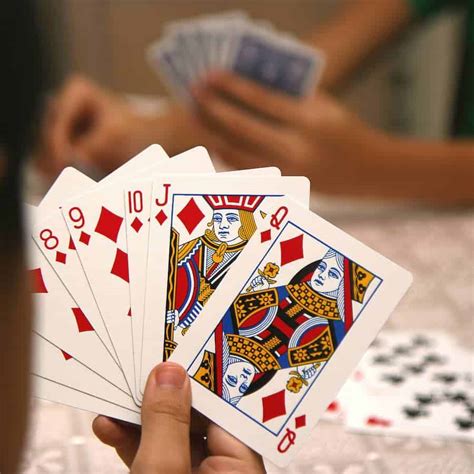 If that card is a red Three or a wild card, reshuffle it into the stock and turn over a different card. Play proceeds clockwise from the dealer. Playing the Game. Before taking their first turn of the game, each player must place any red Threes they hold face-up in their melding space, then draw the same number of cards from the stock.. 
