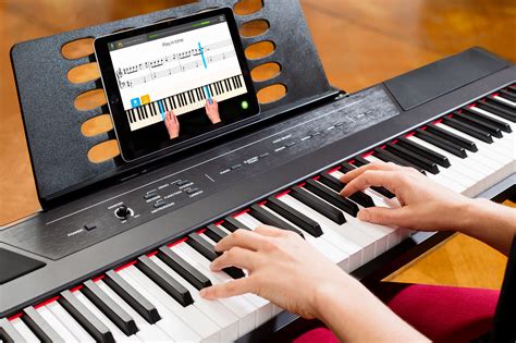  A digital piano includes pedals and a base, while a digit