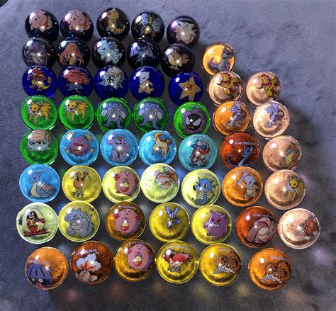  All of my marbles were new 18yrs ago and stored in a pouch. Colors may be a little differant than shown. Glass is hard to photograph. Type: Pokemon Glass marble; Brand: Pokemon ; Marbles are shipped in a bubble mailer, first class, and includes tracking and delivery confirmation. Many people think that more perfect-looking marbles are worth more. . 