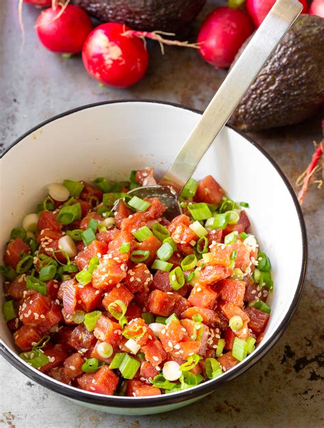 Combine 1 pound diced sushi-grade tuna, 1 cup diced cucumber and 1/4 cup chopped scallions in a bowl. Add 2 tablespoons soy sauce, 1 tablespoon toasted sesame seeds, 1 teaspoon each lemon juice ...