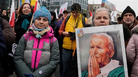 Poland marches defend John Paul II from abuse cover-up claim