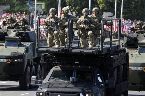 Poland showcases military might in a parade as war rages in neighboring Ukraine