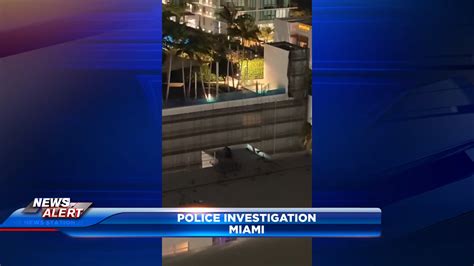 Police: woman armed with gun jumps off roof in Miami