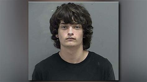 Police arrest 18-year-old homicide suspect, find guns, cash