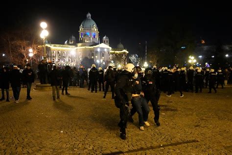 Police in Serbia fire tear gas at election protesters threatening to storm capital’s city hall