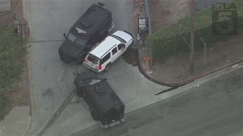 Police in barricade situation with pursuit suspect in L.A.