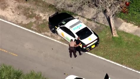 Police pursuit ends in NW Miami-Dade; suspect swims across canal, flees on foot