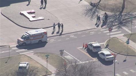 Police say 2 adult faculty members shot at a Denver high school; suspect at large