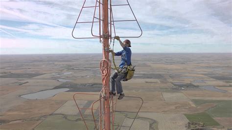 Police working to contact person climbing radio tower