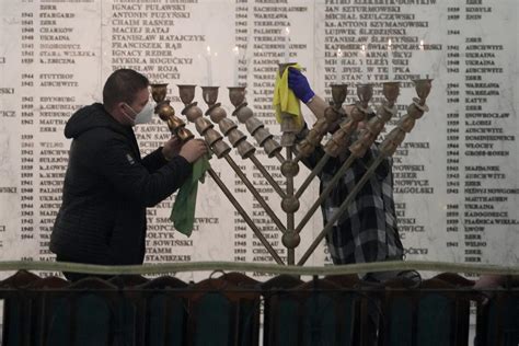 Polish far-right lawmaker extinguishes Hanukkah candle in parliament