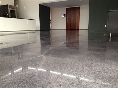 Polished concrete floor cost. Costs can range from $2 per square foot for a basic to $30 or more for high-end artistically rendered floors. Basic design: $2 to $6 per square foot. A basic concrete floor design includes pouring the slab or overlay, then a basic polishing and single colorizing treatment (staining or dyeing). Mid-range design: $7 to $14 per square foot. 