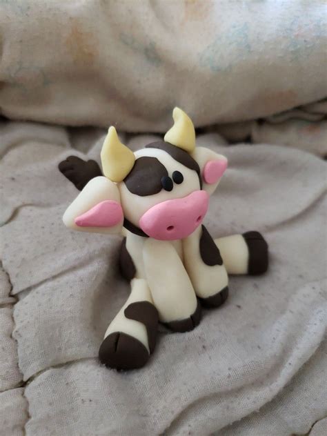 Polymer Clay on LinkedIn: We sculpt a cartoon cow from polymer …