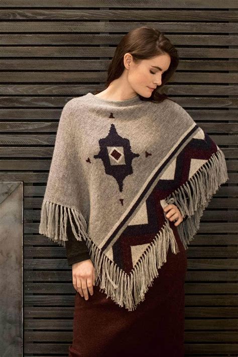 Poncho - poncho meaning: 1. a piece of clothing made of a single piece of material, with a hole in the middle through which…. Learn more. 