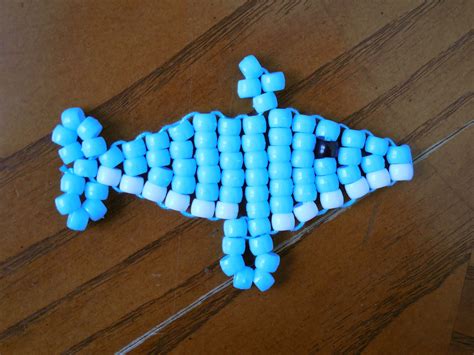 Pony bead dolphin pattern. This video shows you how to make a cute 3D dolphin out of perler beads. 