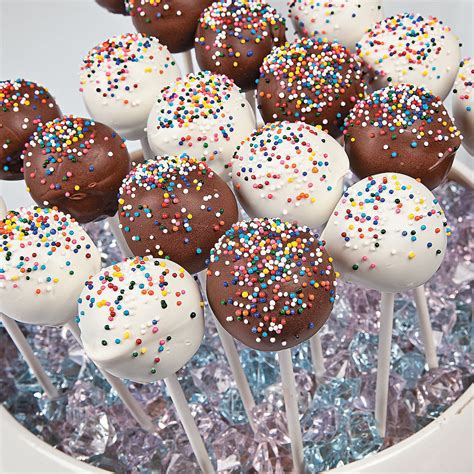 Pop cake. This helps the cake ball stay secure on the stick when dipped in the coating. Coat the Cake Pops: Dip each cake pop into the melted candy once the sticks are inserted. Gently tap off any excess coating. If the candy coating is too thick, you can thin it with coconut oil or vegetable shortening. 