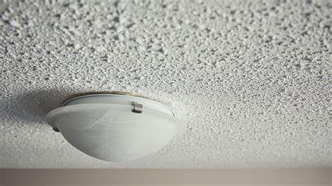 Popcorn ceiling. The next step towards removing your popcorn ceiling is to apply moisture to the area. This helps reduce dust and makes scraping considerably easier. Use a garden sprayer or spray bottle to mist water onto the ceiling. Aim for a light misting, as too much water could damage the drywall. Wait 15 minutes. 