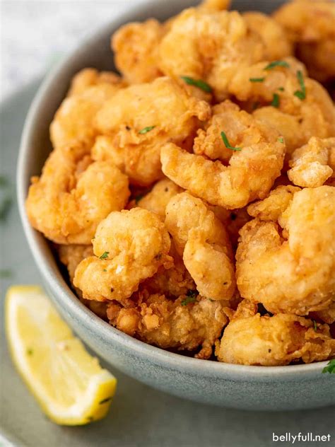 Popcorn shrimp. Cooking frozen popcorn shrimp in the air fryer is so simple: Remove the frozen popcorn shrimp from the packaging and remove any excess breading that has fallen off in the box. Place your popcorn shrimp into your air fryer basket. Cook for 8 minutes on a medium temperature. Serve with your other favourite frozen foods! 