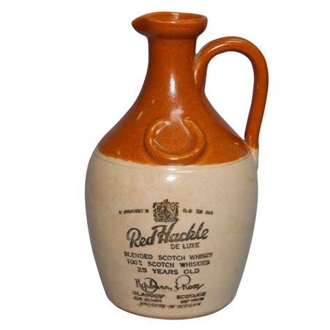 A very nice bottle not often seen for sale. $395.00. 2 (RARE WESTERN WHISKEY) 11 1/4" tall, clear glass, tooled top, smooth base, round cylinder whiskey. Embossed on the front of the bottle : "BOTTLED BY / CLINCH / MERCANTILE CO. / monogram / DEALERS IN / WINES & LIQUORS / GRASS VALLEY, / CAL.. 