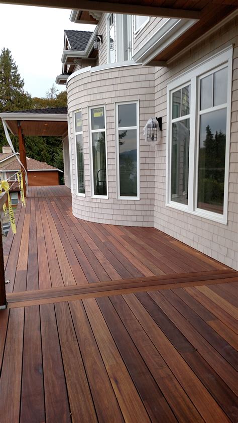 Porch stain. Step 1: Sweep the Surface. In order to successfully stain a deck, the surface must be completely dry and clear of debris. Working on a sunny day with no forecast for rain, start by sweeping deck with broom. TIP: New decks simply need sweeping prior to staining. Old, weathered decks require pressure washing. 