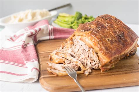 Pork picnic roast. After 3 hours remove the pork from the oven and gently lift the rack off the pan. Scatter the carrots, potatoes, onions and garlic in an even layer and season with salt and pepper. 