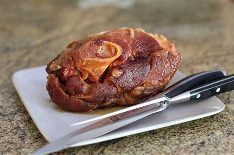 Pork shoulder smoked. Place pork shoulder in the smoker and toss 4-6 wood chunks onto the hot coals. Cook for about 8 hours until the internal temperature of the meat reaches 200°F on an instant read thermometer. Mop the shoulder … 