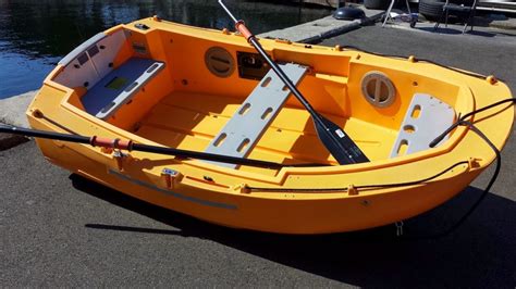 ***PRICED REDUCED FROM $2,900.00***PORTLAND PUDGY SAFETY DINGHY / LIFE BOATSUNSET YELLOW Very gently used. Basic Boat Includes;* Two 6'-6" collapsible aluminum oars with retaining sleeves and collars ($128 value).* Richie compass standard.* Towing bridle harness (secures to two stainless steel eyes with backer disk for towing, …