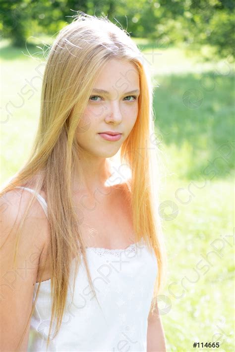 Portrait of a Young Attractive Woman Stock Photo - Image of grass, hair …