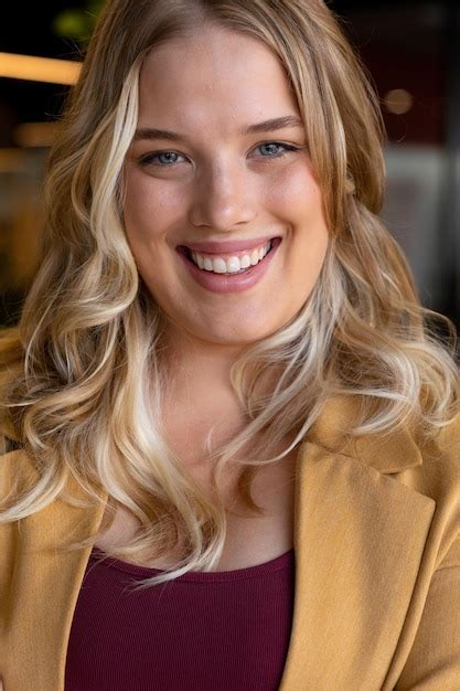 Portrait of happy caucasian plus size woman in front of mirror …