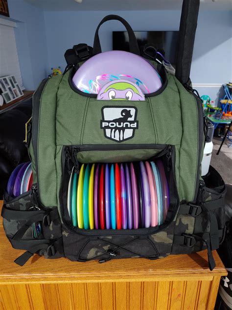 Pound disc golf. Rated 4.83 out of 5 based on 12 customer ratings. ( 12 customer reviews) $ 54.99 – $ 59.99. The TRVRS LT (Traverse Lite) backpack-style Disc Golf Bag is all you need to take with you on any course! Boasting a 20+ disc capacity, this feature-packed bag has eight different pockets and storage pouches for your discs and gear (in addition to the ... 