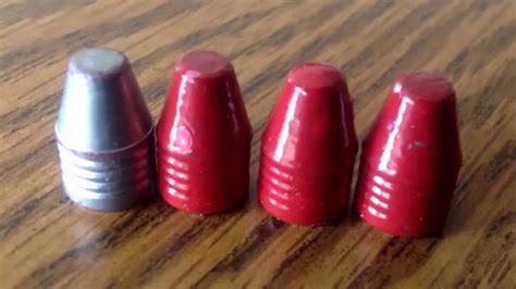 Powder coating 223 cast bullets.  Both with my Cast & Powder coated...