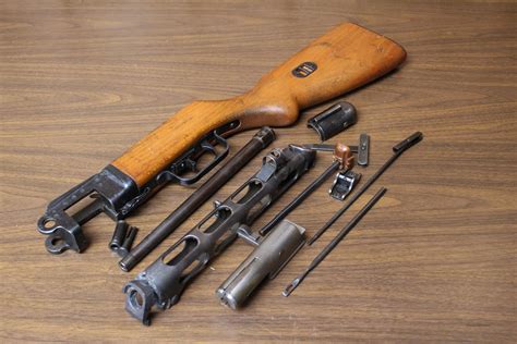 PPSh-41 parts kit, wood stock, w/ cut barrel shroud, 7.62X25, Soviet, in *Good* condition. Sold as a parts set (kit pictured is the one you will receive) These are rare kits to add to your collection! These kits are complete less the receiver, and possibly some small pins, spring, etc.... 