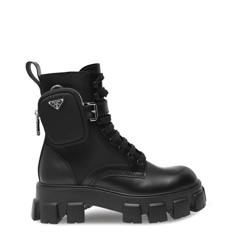 Prada monolith boots. These Monolith boots made of Re-Nylon Gabardine have oversized volumes and strong lines. The boot is distinguished by the rubber inserts on the bottom part of the upper and the lug sole. This product does not contribute to the SEA BEYOND educational program. 