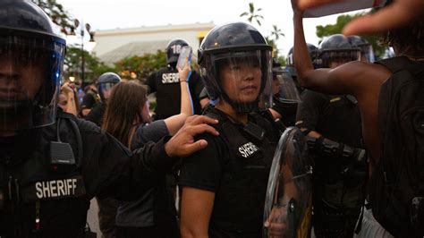 Press photographer arrested at protest over chokehold death