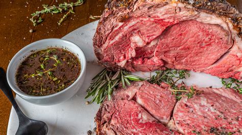 Prepare and roast the prime rib: In a small bowl, whisk together the olive oil, kosher salt, and black pepper. Rub the mixture all over the outside of the roast and set aside for an hour to come to room temperature. Preheat the oven to 450°F (425°F convection).