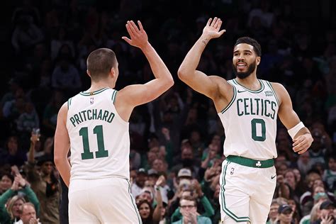 Pritchard signs extension, leads Celtics over 76ers 114-106 in preseason opener