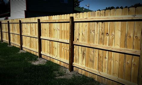 Privacy fence installation. Step 9. Attach the pickets to the rails using 2 inch screws or an air nailer. Use 2 nails for each rail (6 total for each picket). You may need to rip the last picket for each section to get a perfect fit. Use a table saw or circular saw to rip the picket. 