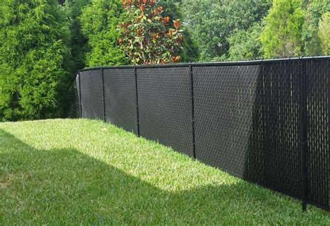 Privacy for chain link fence. Chain Link Fence with “Factory Inserted Slats”™ - VinylWood® (3 1/2” X 5” Mesh - Near Total Privacy) · is a durable chain link fence with simulated wood grained ... 