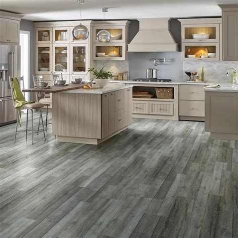 Shop Style Selections Forged Oak Gray 12-mil x 7-in W x 48-in L Waterproof Interlocking Luxury Vinyl Plank Flooring (23.21-sq ft/ Carton) in the Vinyl Plank department at Lowe's.com. Style meets function with Style Selections rigid core flooring! Designed with DIYers in mind, enjoy easy installation with this &#8216;click and lock&#8217;