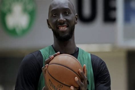 Professional basketball player Tacko Fall hands out new book to hundreds at Austin mosque