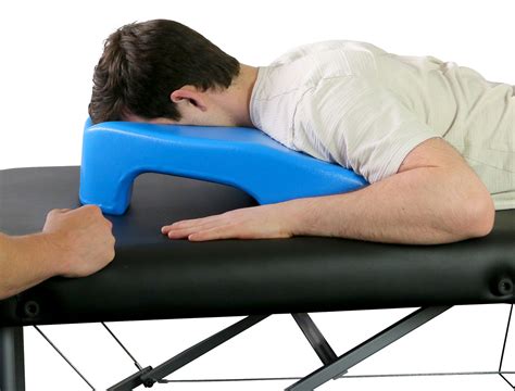 Prone pillow. The Prone Pillow was developed using a moulded foam with smooth skin for cleaning. It can be used as a support to elevate the patient's head, whilst also providing support to the head and shoulders. The design of the Prone Pillow helps to reduce patient discomfort whilst they are lying face down. Features: Moulded foam 