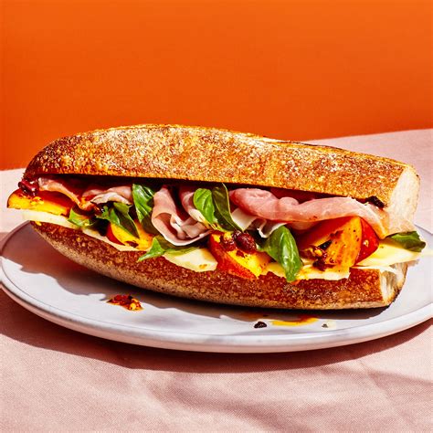 Prosciutto sandwich. Heat a tiny drizzle of oil in a frying pan and add the prosciutto. It will start to crisp up immediately. Fry for about 30 second, flipping halfway through then transfer to a paper towel lined plate. Butter one side of each slice of bread and fry in the same pan until browned and crispy. Remove to a cutting board. 