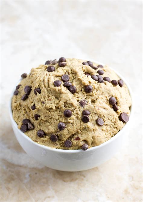 Protein cookie dough. Introduce a nutty richness to the dough by blending in 2 tablespoons of natural peanut butter, ensuring the ingredient list includes only peanuts and salt for an authentic taste. Complete the symphony of flavors with the addition of 1/3 cup of dark chocolate chips, creating delightful pockets of chocolatey goodness. 