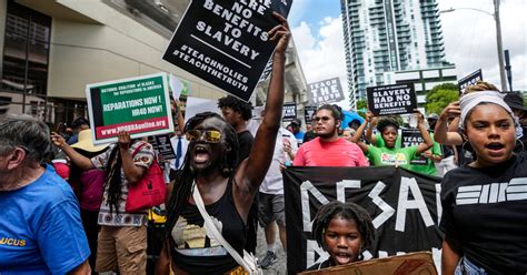 Protesters march through Miami to object to Florida’s Black history teaching standards
