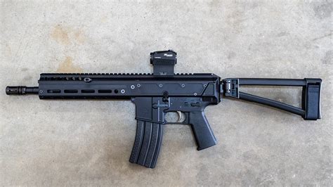 The PSA JAKL offers a buffer system that is fully captured in the upper receiver, shortening the firearm's overall length. Completed with a Pin & Weld JMAC Customs GFHCE-28-S-KM Muzzle Device Pin & Weld, F5 MFG Modular Stock System, Magpul SL Carbine Stock which allows for a side-folding Stock, and PSA Enhanced Polished Trigger fire control group.